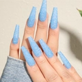 Close-up of long square blue glitter press-on nails worn on hands with sparkling finish - Blue Diamond Glitter