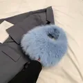 Light blue faux fur handbag with a circular fluffy design for autumn and winter fashion - Light Blue