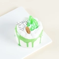 Detailed view of artificial cake model with green glaze and kiwi fruit on ceramic plate - Single Pack Without Packaging / Apple Green