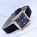 Detailed view of square quartz watch with black roman numeral dial and leather strap - Black