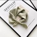 Elegant green satin square scarf tied in a bow on an artistic decorative frame - Light Green