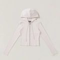Détails de la texture côtelée et du zip sur le sweat à capuche ajusté de couleur beige - XS / Blanc neige