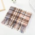 Detail view of pink and purple plaid cashmere scarf featuring colorful long fringes - Grid Light Orange