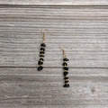 Close-up of handmade natural black crystal tassel earrings with elegant gold accents - Gold Obsidian