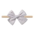 Macro detail of lavender polka dot cotton bow on a beige elastic nylon baby headband - Lavender Polka Dot (8)
