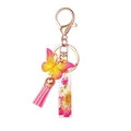 Pink resin letter keychain with dried flowers, butterfly pendant, and tassel accessory - Flower Pattern I