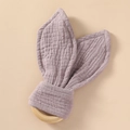 Detailed texture of cotton muslin bunny ear teether with natural wooden ring for infants - Light Purple