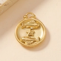 Macro shot of gold 18K stainless steel Pisces zodiac pendant with fish and star details - Pisces