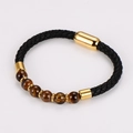 Macro detail of men's braided leather bracelet with tiger eye beads and magnetic clasp - Brown Beads (Tiger Eye)