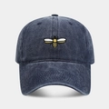 Vintage washed navy blue baseball cap featuring detailed bee embroidery on the front - Navy Blue