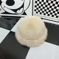 Detail shot of plush off-white faux fur texture on a thick winter bucket hat - Off White
