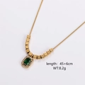 Detail view of gold necklace with green cat-eye stone pendant and square metal beads - Rectangle Green Emerald Pendant