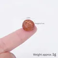 Miniature 1.3cm diameter fake bread model with brown baked texture on a fingertip - Mini Mushroom