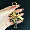 Detail of letter T resin keychain with real daisy flowers gold foil and bee charm - Letter T