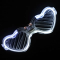 Macro detail of LED glowing heart shutter glasses with bright white cold light on black background - Heart White