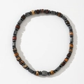 Mens bracelet with natural semi-precious stone beads and hematite cylinders on white background - Dark Grey Metal Cylinder Brown-Red Beige Stone Bracelet (B-B24061114A)