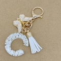 Resin initial C keychain with gold foil flakes, butterfly charm and white tassel fringe - Letter C