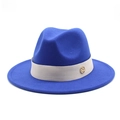 Detail of royal blue wool fedora hat featuring grey ribbon and gold metal M emblem - Blue