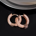 Classic rose gold hoop earrings with full pavé white zircon stones on black reflective surface - Rose Gold - White Zirconia