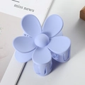 Detail view of the matte purple floral hair claw clip on a stylish magazine surface - 7cm / Blue Gray