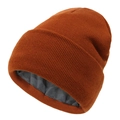 Detail view of winter knitted hat featuring thick grey fleece lining and caramel knit texture - Caramel Orange