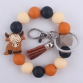 Silikonperlen-Schlüsselanhänger mit braunem Kuh-Anhänger und Lederquaste am Armband - Yak Braun