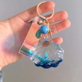 Blue liquid quicksand shell keychain with starfish toy and iridescent laser strap - Royal Blue Shell