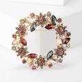 Elegant gold flower wreath brooch featuring multicolored rhinestones on a white background - Purple/Multi-color