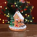 Resin Christmas gingerbread house decor with snow roof and family figures, 10cm height - Gingerbread Family Snow House (7142R-04)