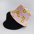 Wendbarer Fischerhut mit einer einfarbigen schwarzen Seite und einer rosa Seite mit Smiley-Muster - Erwachsene 55-58cm / Rosa lächelndes Gesicht