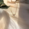 Elegant gold titanium steel necklace featuring a crystal heart pendant on o-chain - X506 Gold Three-Stone Heart