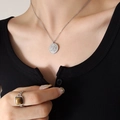 Silver zodiac necklace with sun pattern dial pendant shown on a model neck - 40+5cm / Steel Color (P443)