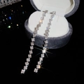 Macro shot of silver tassel earrings with sparkling rhinestones in a velvet jewelry box - Silver (Silver Pin)