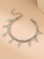 Macro detail of silver double-layer bracelet featuring leaf charms and crystal tennis chain - Leaf / Silver