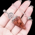 Handheld tree of life hexagonal crystal pendulum with gold resin and metal chain - Goldstone (Synthetic)