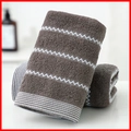 Thick brown cotton towel featuring a white zigzag pattern and textured absorbent finish - Cotton Wave Coffee (Towel)