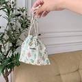 Detail of floral drawstring pouch showing linen texture and colorful botanical patterns - Floral Rhombus