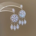 Detail of silver tassel earrings with sparkling cubic zirconia crystals on acrylic stand - Tassel Drop / Silver (Silver Pin)