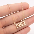 Close-up of gold stainless steel necklace featuring 1993 birth year pendant in gothic font - 1993 / Gold