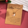 Detailed view of cartoon reindeer pendant on gold chain with Christmas greeting card - Cartoon Reindeer