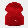 Close-up of the red ribbed knit beanie featuring a white embroidered letter N - One Size / Red