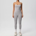 Front view of a light gray high-waisted yoga set featuring thin strap tank top and leggings - Frost Grey