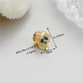 Golden skull bead with colorful enamel flowers and 4.5mm hole for DIY jewelry making - Golden Flower Skull