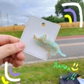 Detail of a cat-shaped acetate hair clip in mint green marble on jewelry card - Clear Green