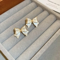Elegant bow-shaped earrings with cream pearlescent finish and gold trim in a velvet box - Gold Trim Cream White Bowknot Stud Earrings (44# Silver Needle - Gold - White (Real Plated))