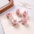Detailed view of pink and white hand-painted acrylic beads for DIY jewelry making - Transparent + Pink/White Cream + White Heart