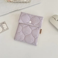 Macro detail shot of a lavender quilted mini storage bag for lipstick and pads - Light Purple