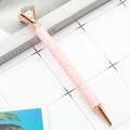 Pink sequin ballpoint pen with rose gold trim and a large diamond top ornament - Pink