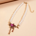 Floral pearl necklace featuring a pink gemstone pendant with dangling tassel detail - Pink Flower Pearl Necklace