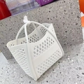 Close-up of a white silicone hollow shopping basket with a diamond-woven pattern - White